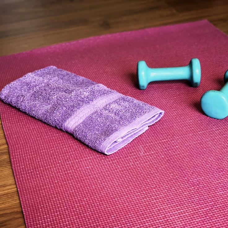 Women in a fitness class doing stretching and mobility exercises